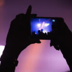 Concert-goer filming with phone