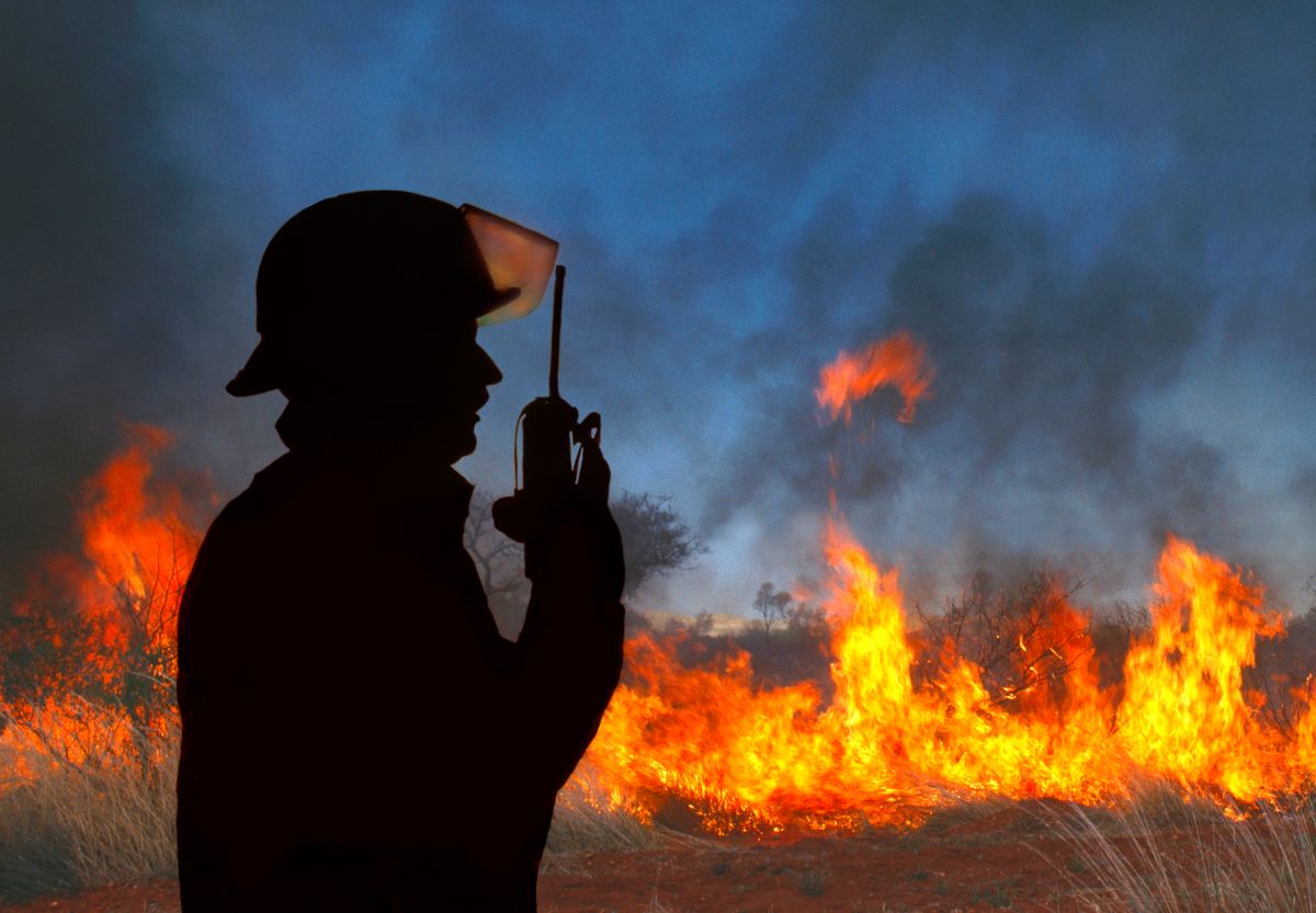 Firefighter at a wildfire on his radio