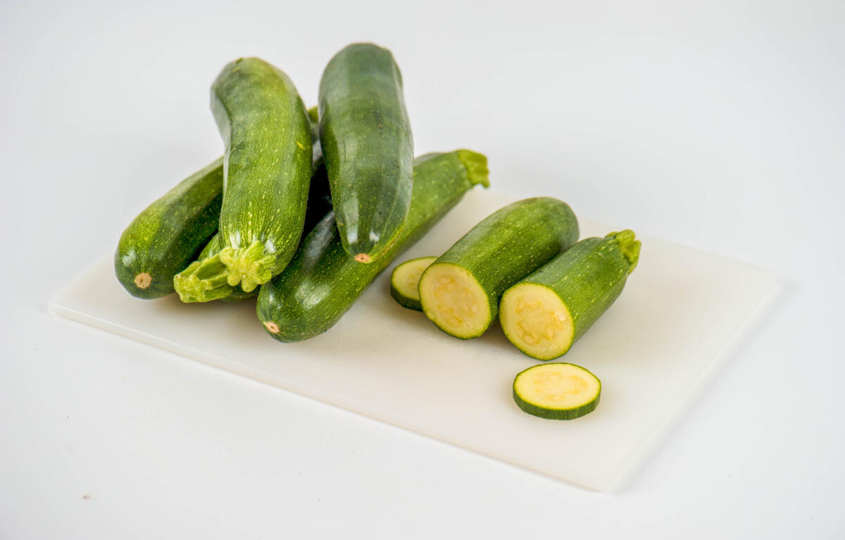 Sliced zucchini on cutting board