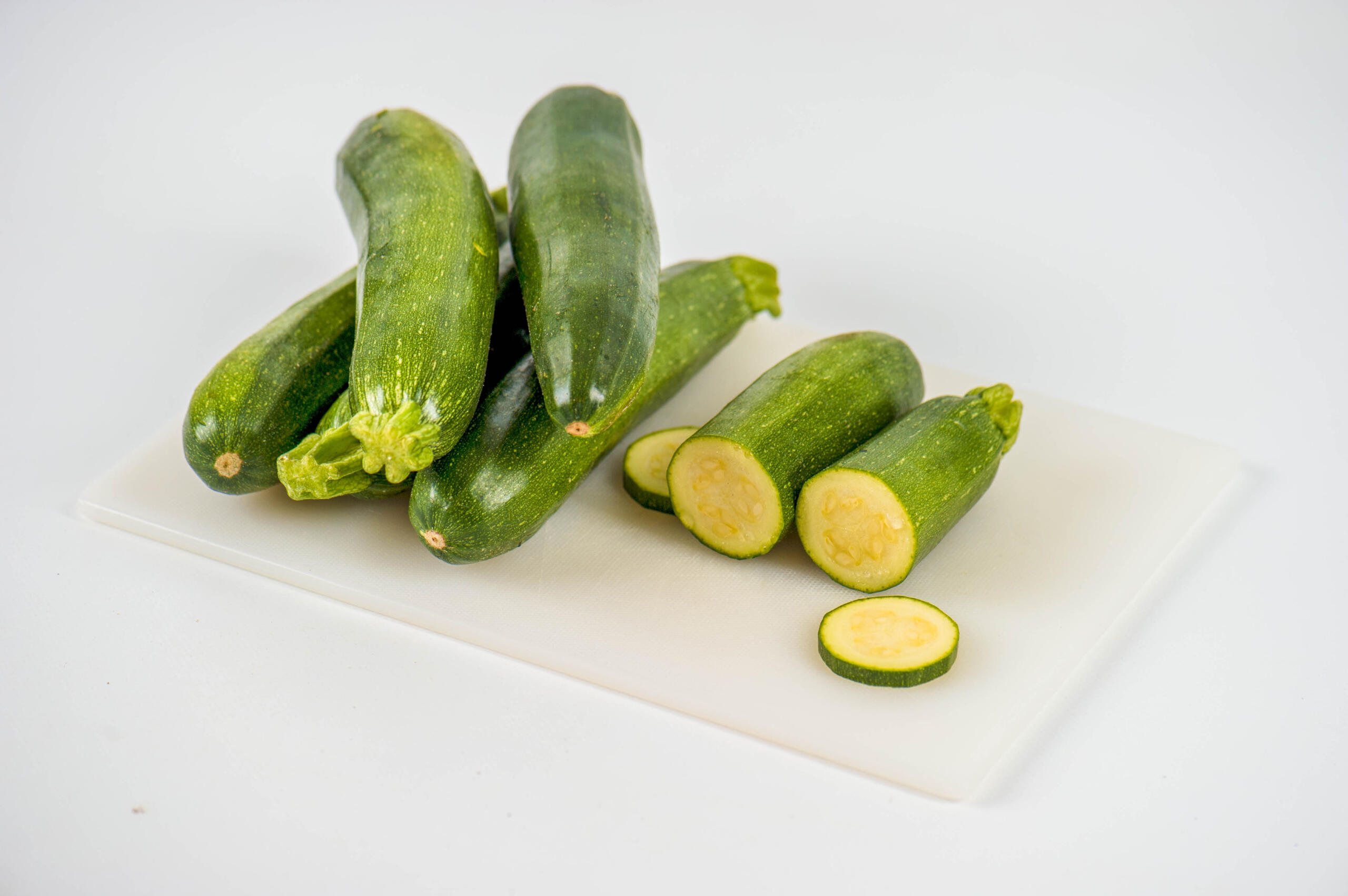 Sliced zucchini on cutting board