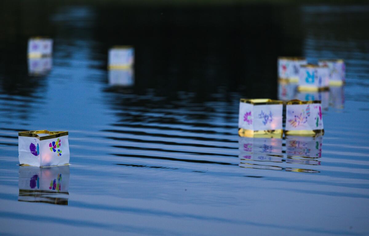 Floating lanterns at a Monadnock Peer Support event at Alyson's Orchard in Walpole.