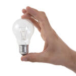 Hand holding lightbulb