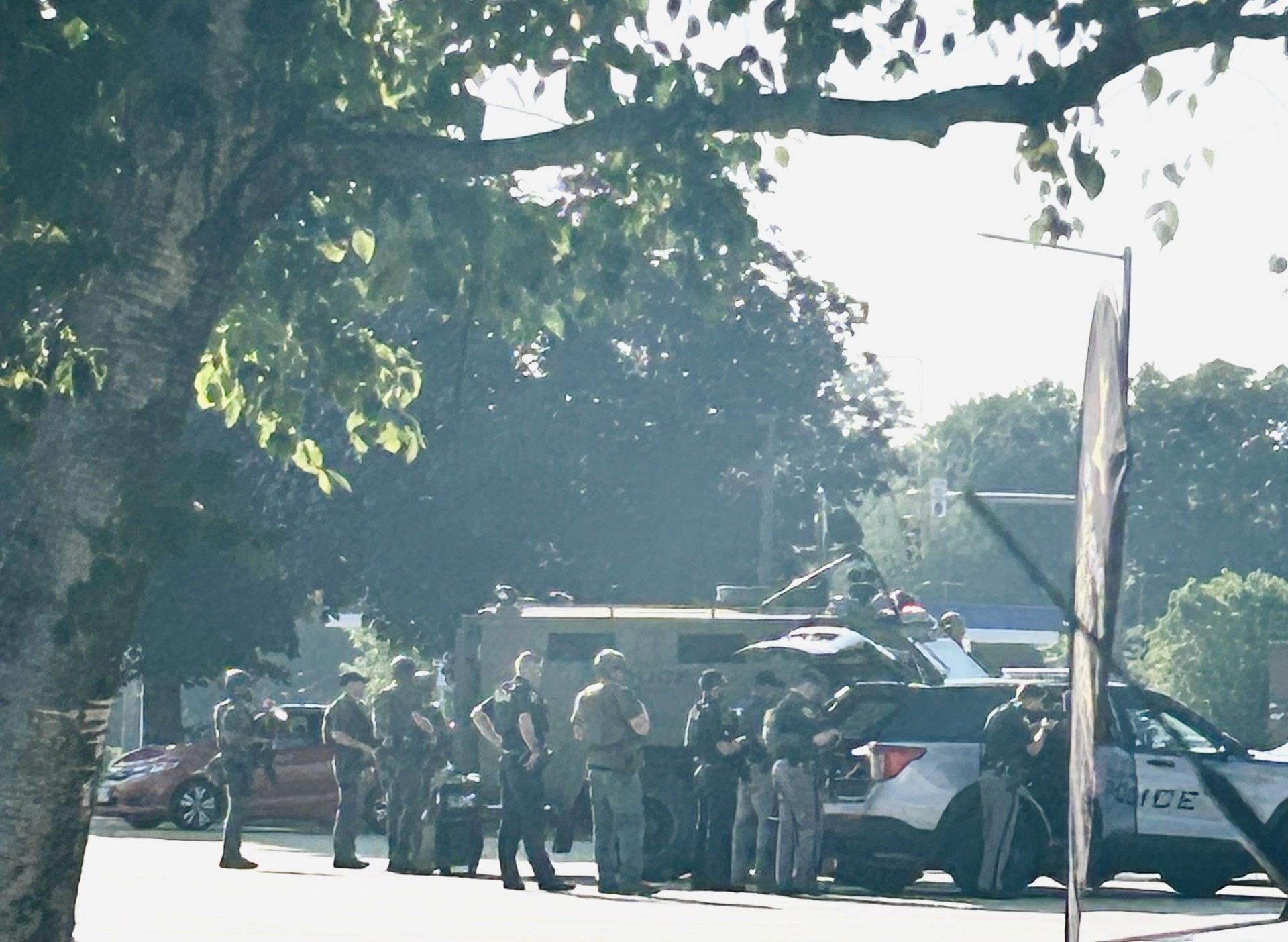Police during a standoff Tuesday in the TD bank parking lot on West Street negotiating with a man inside a vehic.le who was later shot by police.