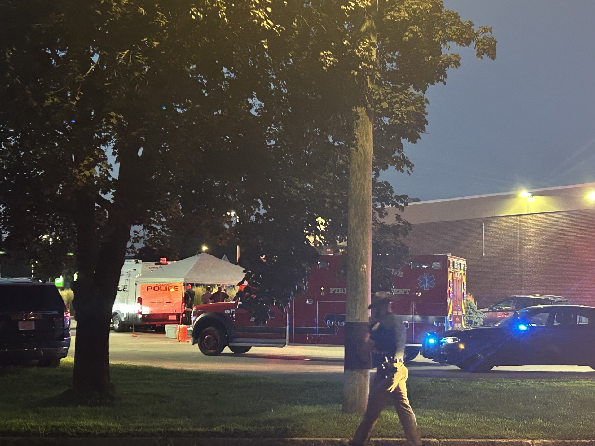 Emergency and police vehicles outside TD Bank after the five-hour standoff ended Tuesday.