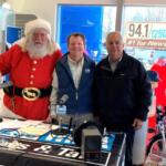 Steve Levy, Toy City owner with Dan Mitchell and Santa