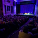 Colonial Theatre director Keith Marks interviews fillmaker Ken Burns after the American Revolution screening at the theater with the old marquee lettering onstage