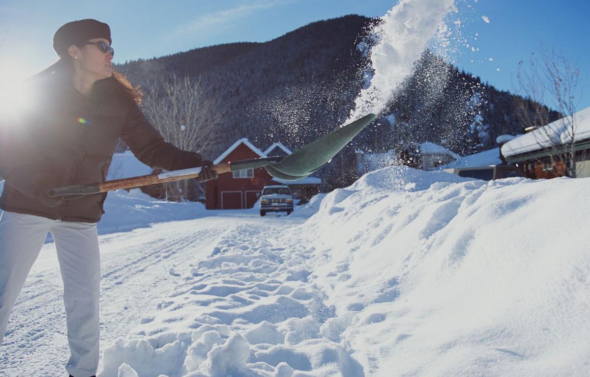 Woman Shoveling snow