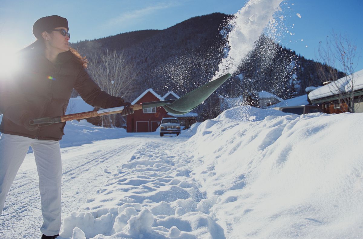 Woman Shoveling snow