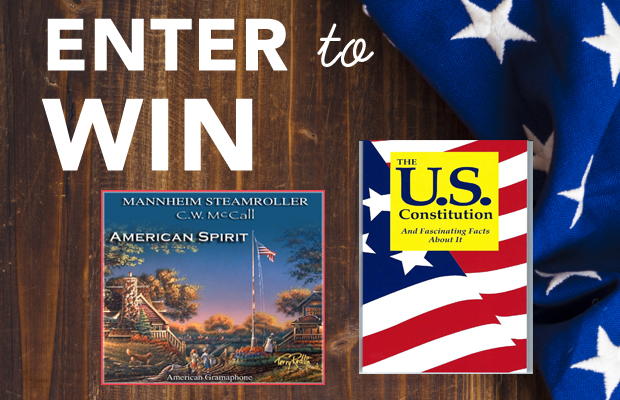 Promotional graphic with 'ENTER to WIN' text; shows two books—American Spirit and The U.S. Constitution—on a wooden background with an American flag motif.