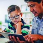 Parent helping child with school work